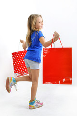 Shopping - Fillette blonde et sacs de magasins