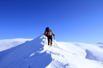 Winter hiking in snowshoes.