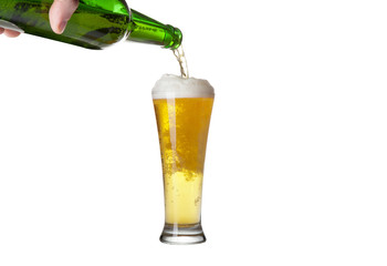 Beer pouring from green bottle into glass isolated on white