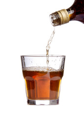 whiskey being poured into a glass