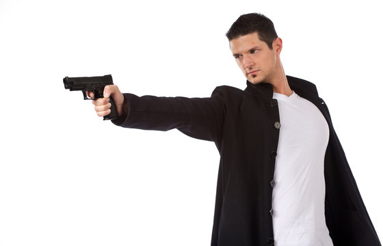 Man shooting handgun with one hand