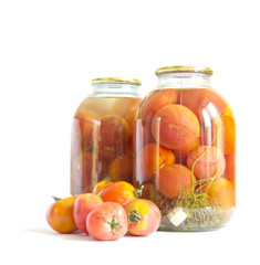 Preserved red tomatoes in a glass jar