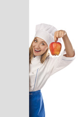 Young cook with apple in studio
