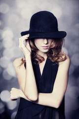 Portrait of beautiful redhead girl in hat.