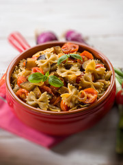 pasta with eggplants and pachino tomatoes, selective focus