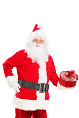 Santa Claus holding a christmas present
