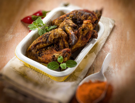 chicken wings baked with paprika spice, selective focus