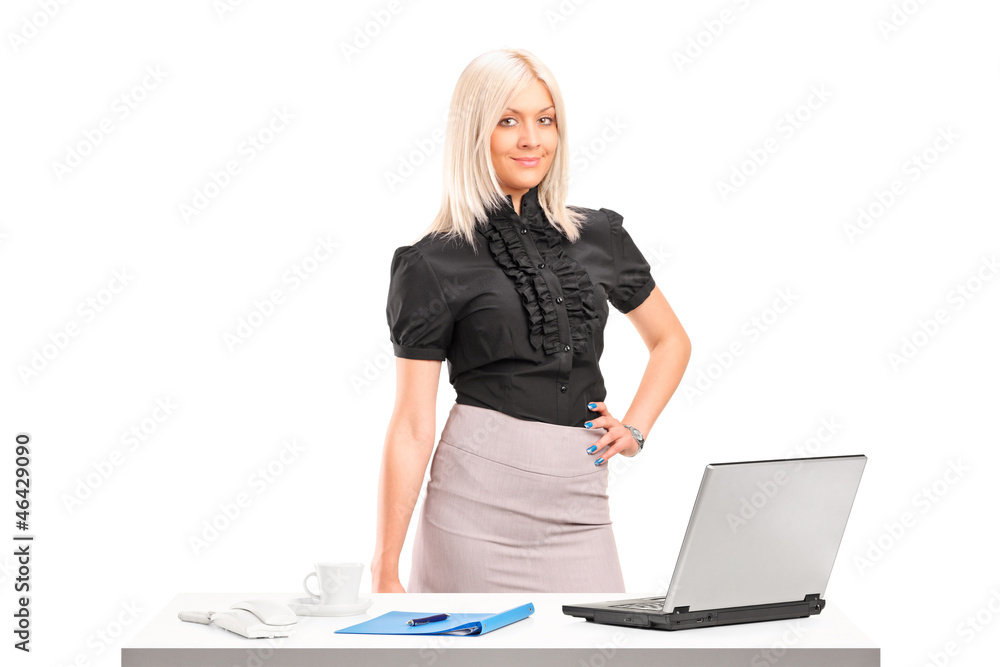 Sticker Professional woman standing next to office desk with laptop