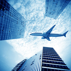 Fototapeta na wymiar Airplane over the city