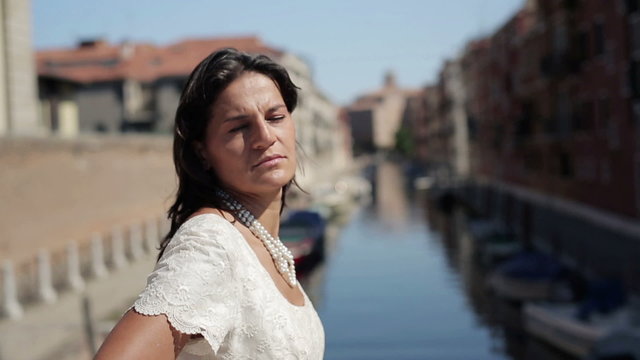 Portrait of young happy bride in Venice, crane shot 