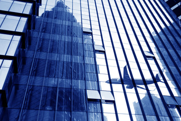 Fototapeta premium Modern glass buildings and aircraft