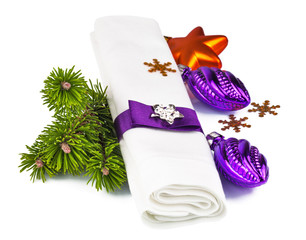 White napkin with Christmas decoration and twig Christmas tree