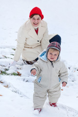 Fototapeta na wymiar Mother and little toddler boy on winter day