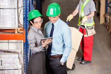 Supervisors And Foreman Working At Warehouse