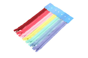 Row of multiple color zipper on white background.