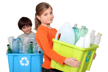 Children recycling plastic bottles