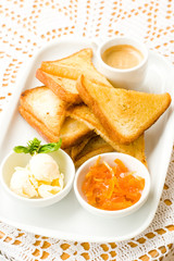 Breakfast: coffee, butter, toasts, candied peel
