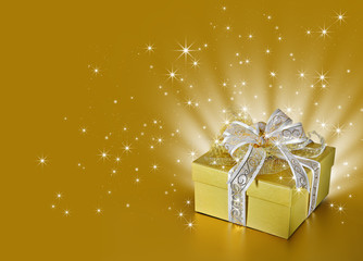 Golden surprise gift box or present with ribbon, bow, stars
