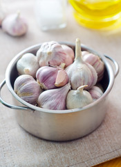 garlic in metal bowl on the table