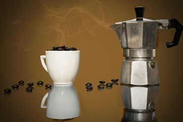 caffettiera,tazzina e chicchi di caffe