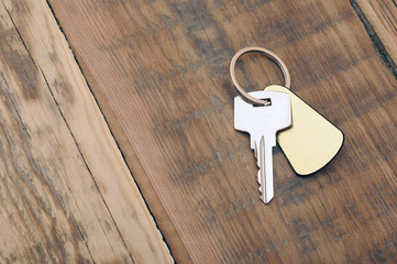 silver key with blank tag