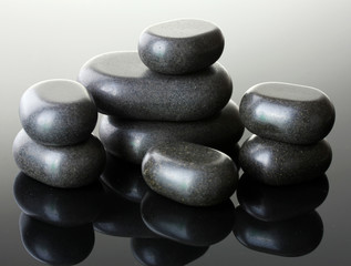 Spa stones on grey background
