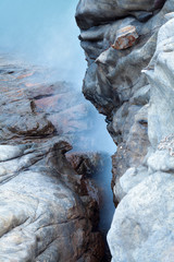 Long exposure of sea and rocks background
