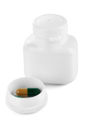 Dispenser for tablets with bottle with pills isolated on white