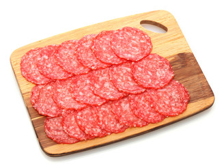 tasty sausage on wooden cutting board, isolated on white