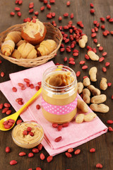 Delicious peanut butter in jar with baking
