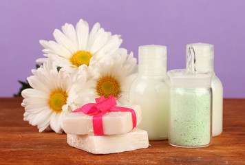 Fototapeta na wymiar ingredients for soap making on violet background