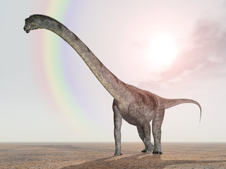 Obraz premium Dinosaurier Puertasaurus mit Regenbogen