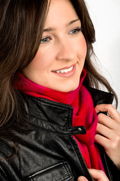 Portrait Of Young Woman Wearing Black Jacked And Red Scarf