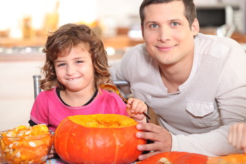 Girl emptying pumpkin