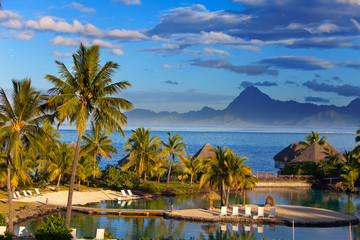 Ocean at sunset. Polynesia. Tahiti... - obrazy, fototapety, plakaty