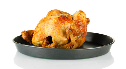 Roasted whole chicken in pan isolated on white
