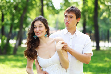 Young love Couple smiling under blue sky