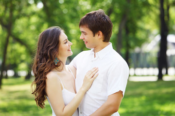 Fototapeta premium Young love Couple smiling under blue sky