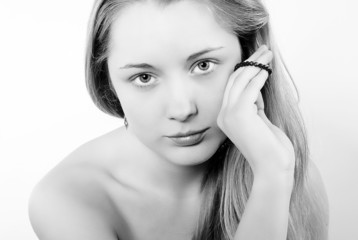 Portrait of the beautiful girl in costume jewellery