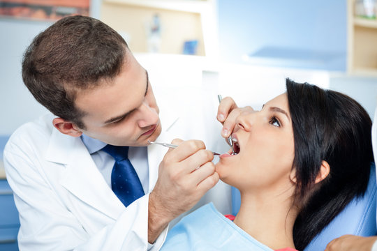 dentists assistant preparing  patient