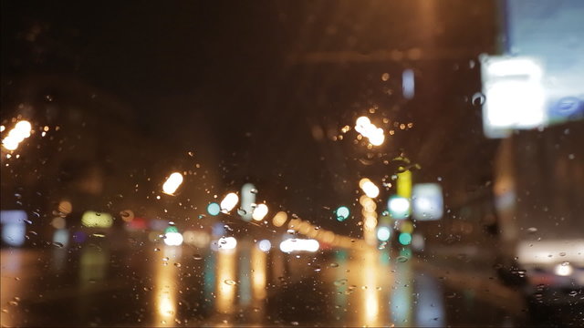 car window rain night background defocused in motion