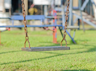 Closeup of swings in a children play area