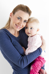 portrait of mother with her baby girl