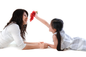 asian mother and daughter lying and