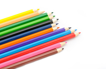 Multi Color pencils on white background.