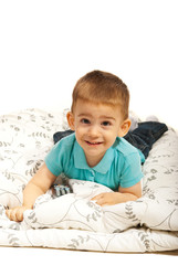 Smiling boy lying on blanket