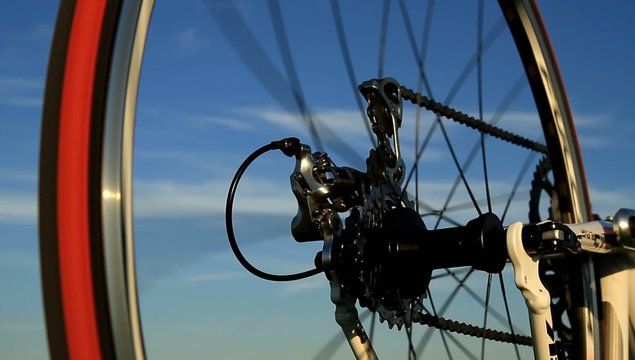 Rear wheel of racing bicycle spinning.