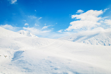 Snow mountains on bright winter day