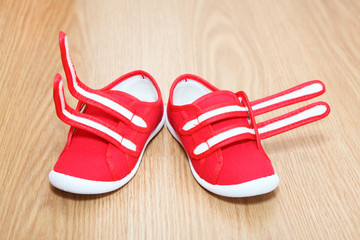 Wrong feet shoes standing on the floor