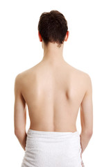 Naklejka premium Young handsome man in towel